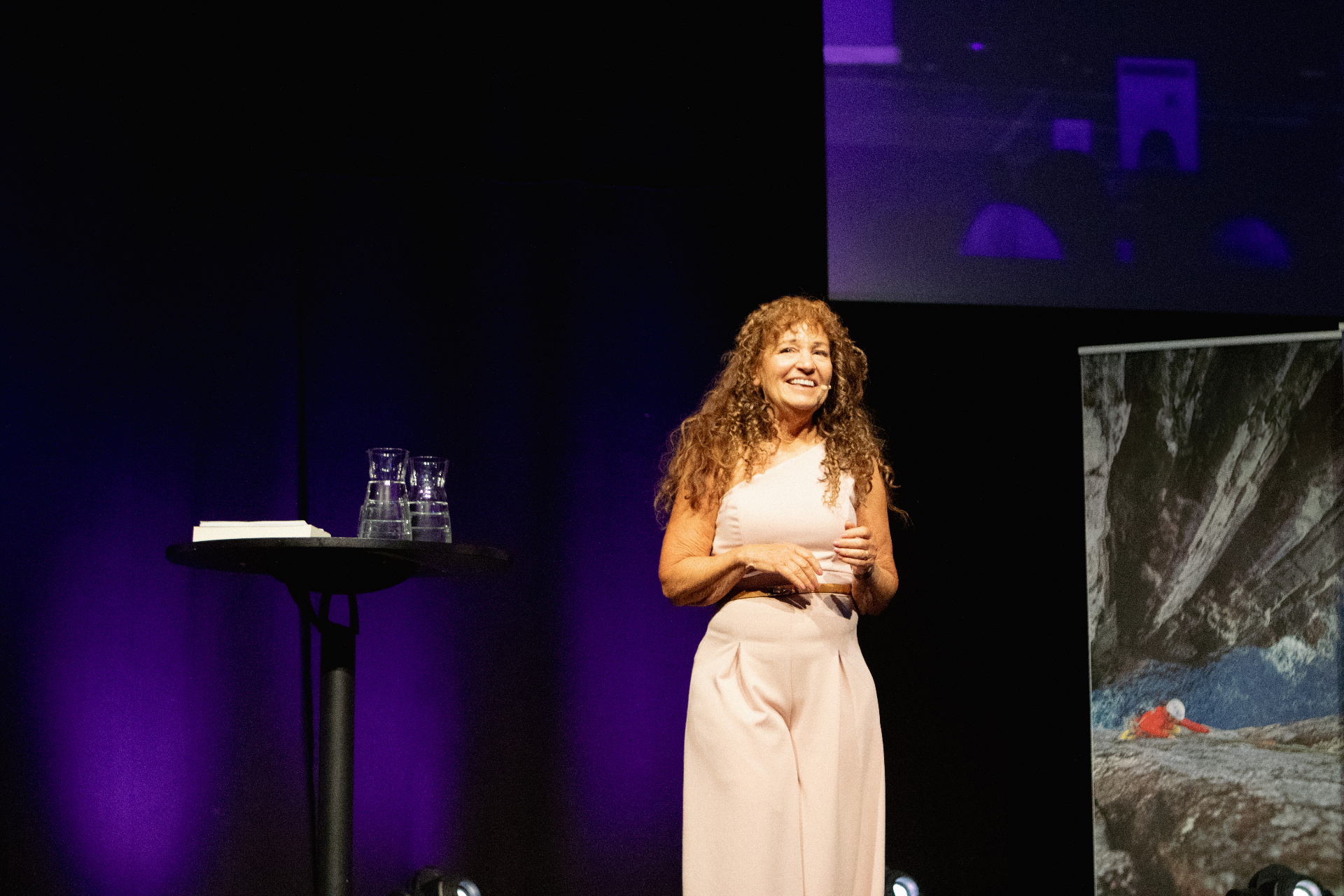 On stage, speaking